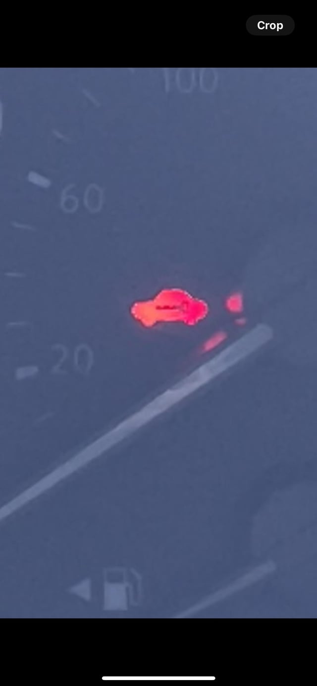 What Does the Red Car Light Mean in a Nissan