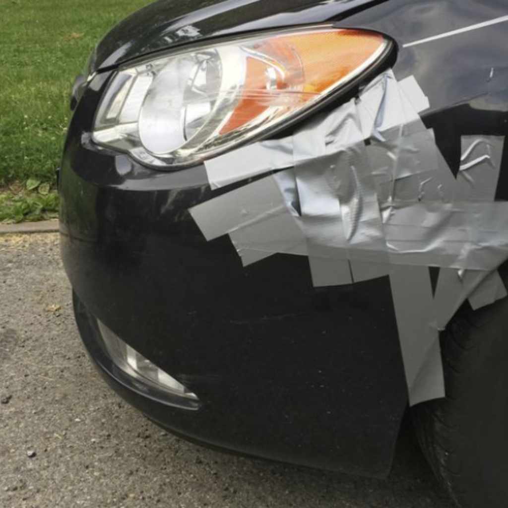 Applying Duct Tape On Cars